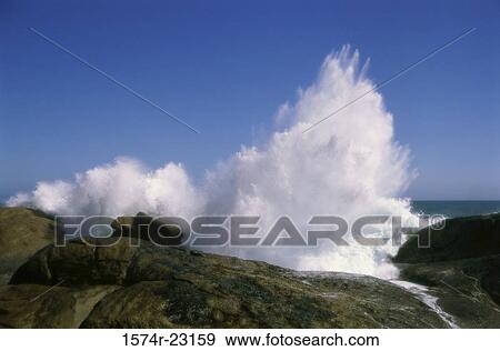 Stock Photo - Waves breaking on rocks, South Africa. Fotosearch