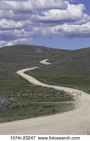 Winding road through the countryside View Large Photo Image Stock Photo - Winding road through the countryside. Fotosearch