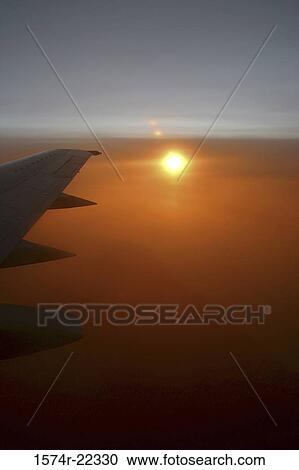 Wing of an airplane in the sky View Large Photo Image Stock Image - Wing of an airplane in the sky. Fotosearch