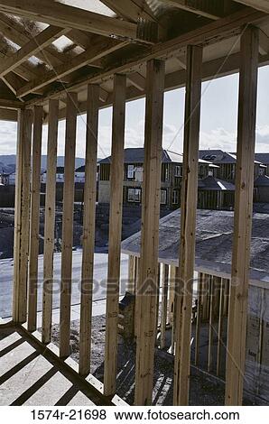 Wooden framework of a house under construction View Large Photo Image Stock Photo - Wooden framework of a house under construction. Fotosearch