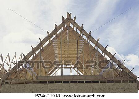 Wooden framework of a house under construction View Large Photo Image Stock Photo - Wooden framework of a house under construction. Fotosearch