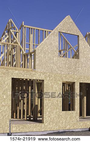 Stock Photo - Wooden framework of a house under construction. Fotosearch