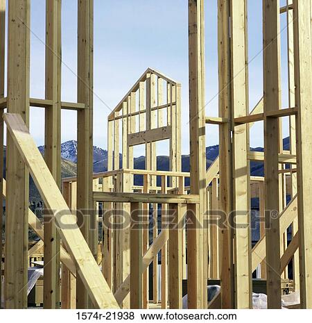 Stock Photo - Wooden framework of a house under construction. Fotosearch