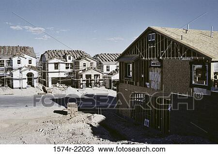 Stock Image - Wooden framework of houses under construction. Fotosearch