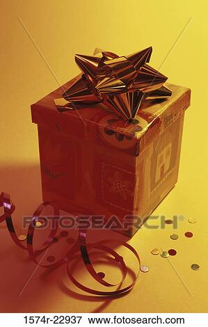 Wrapped gift with decorations View Large Photo Image Stock Photo - Wrapped gift with decorations. Fotosearch