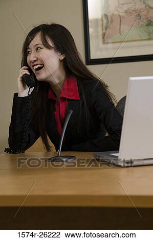 Businesswoman laughing and talking on the phone View Large Photo Image Stock Image - Businesswoman laughing and talking on the phone. Fotosearch