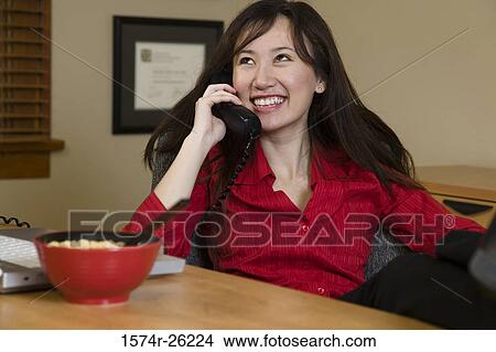 Businesswoman talking on the phone View Large Photo Image Picture - Businesswoman talking on the phone. Fotosearch