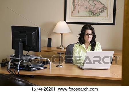 Busineswoman using a laptop View Large Photo Image Stock Image - Busineswoman using a laptop. Fotosearch