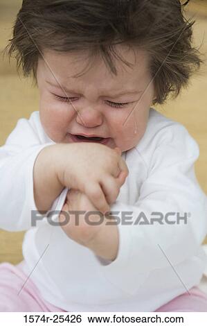 Close-up of a baby girl crying View Large Photo Image Stock Photograph - Close-up of a baby girl crying. Fotosearch