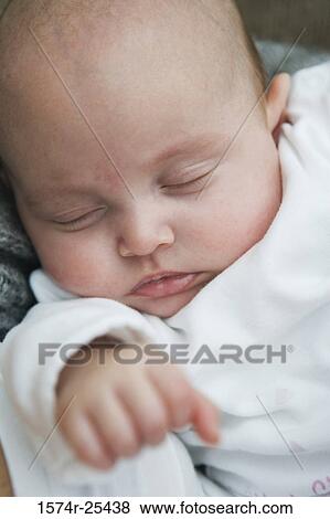 Close-up of a baby sleeping View Large Photo Image Stock Photo - Close-up of a baby sleeping. Fotosearch