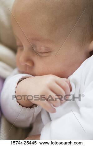 Close-up of a baby sleeping View Large Photo Image Stock Photography - Close-up of a baby sleeping. Fotosearch