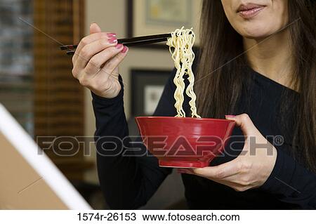 Close-up of a businesswoman eating pasta View Large Photo Image Stock Image - Close-up of a businesswoman eating pasta. Fotosearch