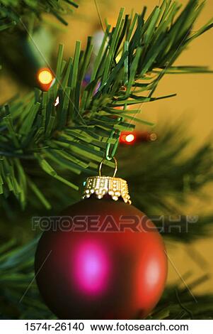 Close-up of a Christmas ornament hanging on a Christmas tree View Large Photo Image Stock Image - Close-up of a Christmas ornament hanging on a Christmas tree. Fotosearch