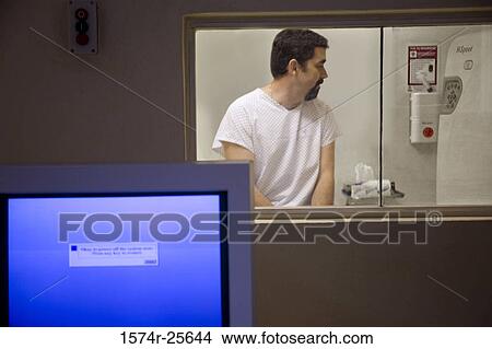 Close-up of a computer monitor with a patient in the background View Large Photo Image Picture - Close-up of a computer monitor with a patient in the background. Fotosearch