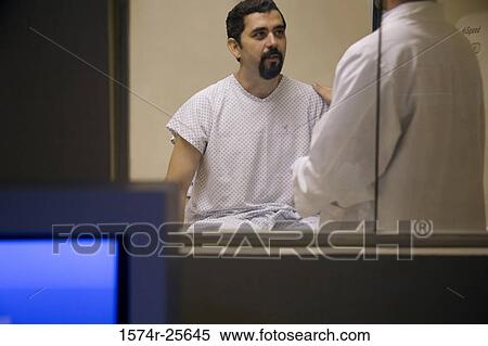 Close-up of a computer monitor with a patient and a doctor in the background View Large Photo Image Stock Photography - Close-up of a computer monitor with a patient and a doctor in the background. Fotosearch