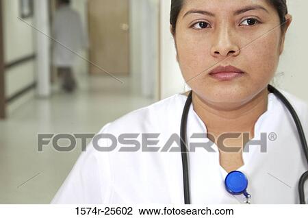 Close-up of a female nurse with a stethoscope around her neck View Large Photo Image Stock Image - Close-up of a female nurse with a stethoscope around her neck. Fotosearch