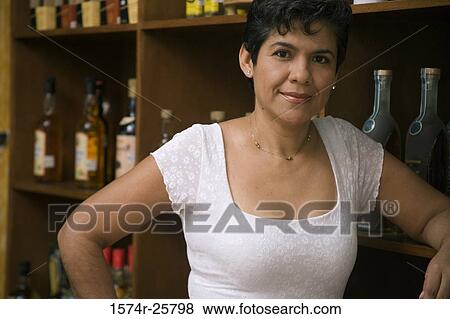 Close-up of a mature woman smirking in a cafe View Large Photo Image Stock Photo - Close-up of a mature woman smirking in a cafe. Fotosearch