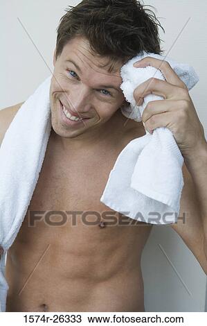 Close-up of a mid adult man wiping sweat from his forehead View Large Photo Image Stock Image - Close-up of a mid adult man wiping sweat from his forehead. Fotosearch