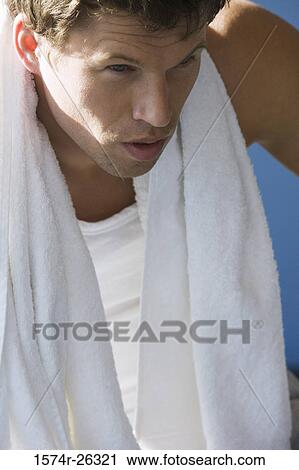 Close-up of a mid adult man with a towel around his neck View Large Photo Image Stock Image - Close-up of a mid adult man with a towel around his neck. Fotosearch