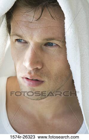 Close-up of a mid adult man with a towel on his head View Large Photo Image Stock Image - Close-up of a mid adult man with a towel on his head. Fotosearch