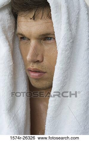 Close-up of a mid adult man with a towel on his head View Large Photo Image Stock Photograph - Close-up of a mid adult man with a towel on his head. Fotosearch