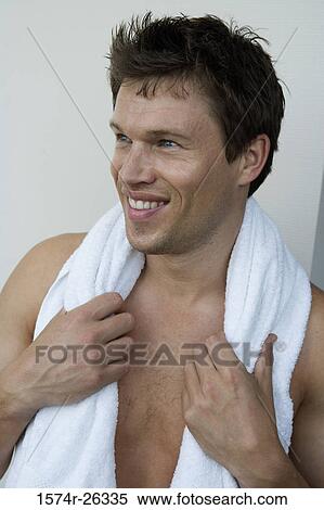Close-up of a mid adult man with a towel around his neck View Large Photo Image Stock Photography - Close-up of a mid adult man with a towel around his neck. Fotosearch