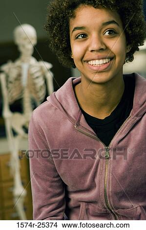 Close-up of a student smiling View Large Photo Image Picture - Close-up of a student smiling. Fotosearch