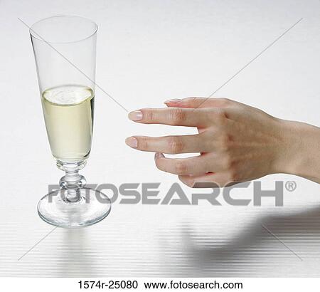 Close-up of a woman's hand reaching for a glass of wine View Large Photo Image Stock Image - Close-up of a woman's hand reaching for a glass of wine. Fotosearch