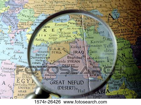 Close-up of a world map viewed through a magnifying glass View Large Photo Image Stock Photograph - Close-up of a world map viewed through a magnifying glass. Fotosearch