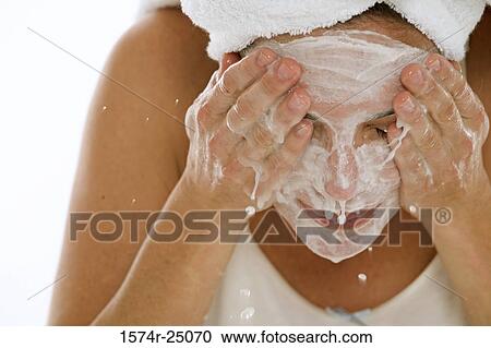 Close-up of a young woman splashing water on her face View Large Photo Image Stock Image - Close-up of a young woman splashing water on her face. Fotosearch