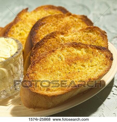 Close-up of garlic bread on a plate View Large Photo Image Stock Photo - Close-up of garlic bread on a plate. Fotosearch