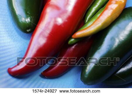 Close-up of red and green chili peppers View Large Photo Image Stock Photo - Close-up of red and green chili peppers. Fotosearch