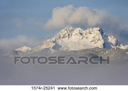 Clouds over snowcapped mountains, Olympic National Park, Washington, USA View Large Photo Image Stock Image - Clouds over snowcapped mountains, Olympic National Park, Washington, USA. Fotosearch