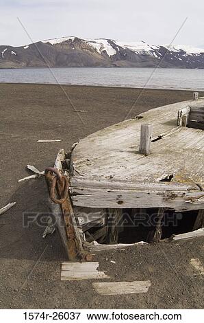 Dilapidated boat on the coast, Telephone Bay, Deception Island, South Shetlands Islands, Antarctica View Large Photo Image Stock Photo - Dilapidated boat on the coast, Telephone Bay, Deception Island, South Shetlands Islands, Antarctica. Fotosearch