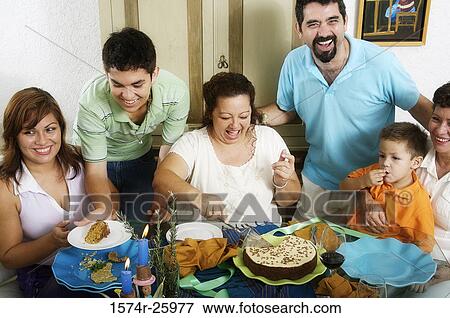 Stock Photo - Family at the dining table. Fotosearch