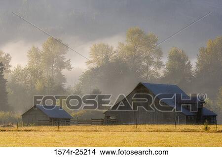 Farmhouse in a field View Large Photo Image Picture - Farmhouse in a field. Fotosearch