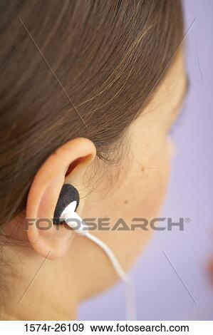 Girl listening to music View Large Photo Image Stock Photo - Girl listening to music. Fotosearch
