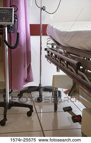 Gurney and an iv drip stand in a hospital ward View Large Photo Image Stock Photography - Gurney and an iv drip stand in a hospital ward. Fotosearch