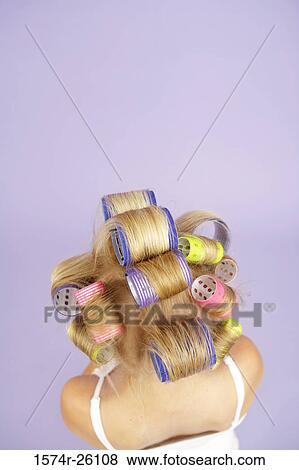 High angle view of a girl with curlers in her hair View Large Photo Image Stock Photo - High angle view of a girl with curlers in her hair. Fotosearch