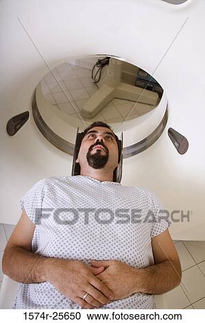 High angle view of a patient getting an MRI scan View Large Photo Image Stock Image - High angle view of a patient getting an MRI scan. Fotosearch