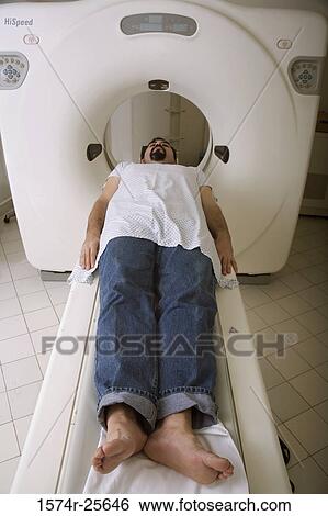 High angle view of a patient getting an MRI scan View Large Photo Image Stock Photograph - High angle view of a patient getting an MRI scan. Fotosearch