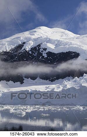 Ice floe floating on water in front of a mountain, Neko Harbor, Gerlache Strait, Antarctic Peninsula, Antarctica View Large Photo Image Stock Image - Ice floe floating on water in front of a mountain, Neko Harbor, Gerlache Strait, Antarctic Peninsula, Antarctica. Fotosearch