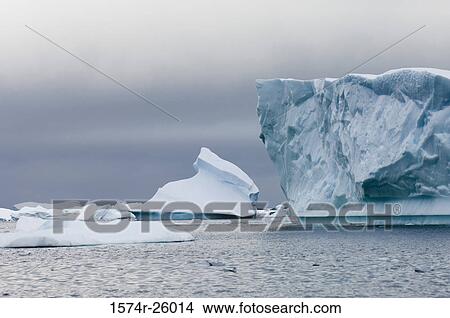 Iceberg floating on water View Large Photo Image Picture - Iceberg floating on water. Fotosearch
