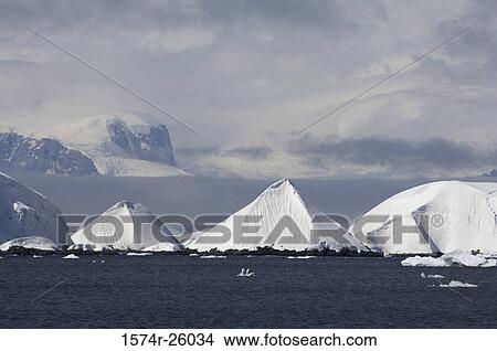 Iceberg floating on water View Large Photo Image Picture - Iceberg floating on water. Fotosearch
