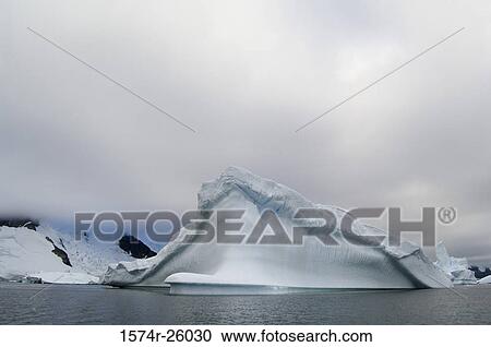 Iceberg floating on water View Large Photo Image Stock Image - Iceberg floating on water. Fotosearch