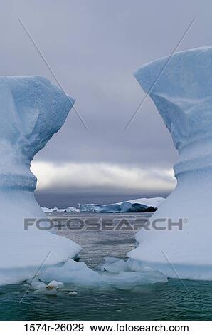 Iceberg floating on water View Large Photo Image Stock Photo - Iceberg floating on water. Fotosearch