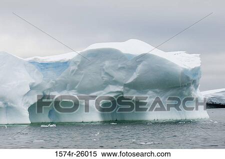 Iceberg floating on water View Large Photo Image Stock Photography - Iceberg floating on water. Fotosearch