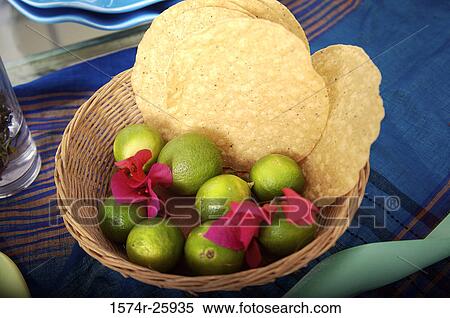 Limes with flowers and tortillas in a basket View Large Photo Image Stock Photography - Limes with flowers and tortillas in a basket. Fotosearch