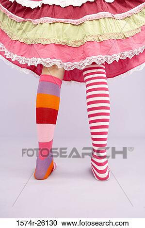 Low section view of a girl wearing stockings of two different colors View Large Photo Image Stock Image - Low section view of a girl wearing stockings of two different colors. Fotosearch