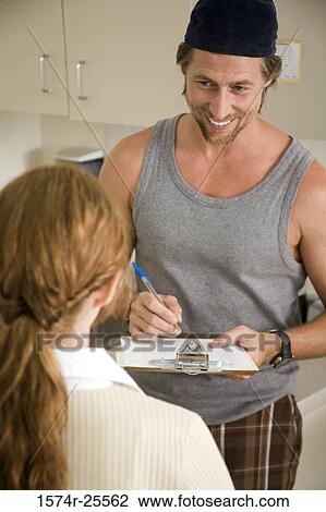 Male nurse taking the report of a patient View Large Photo Image Stock Image - Male nurse taking the report of a patient. Fotosearch
